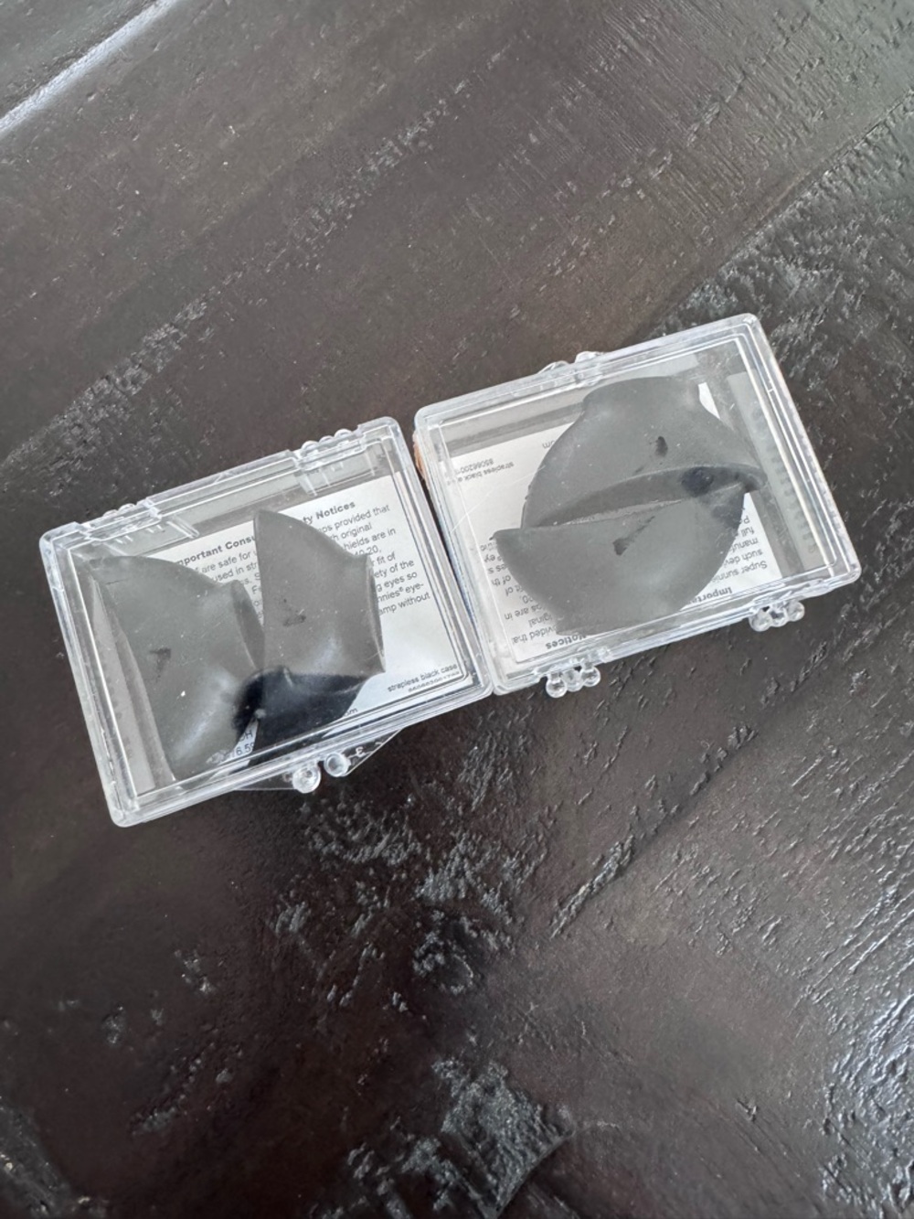 Pair of Black Foam Earbud Tips in Clear Cases